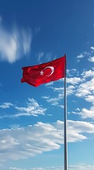 Turkey flag on a flagpole against a blue sky