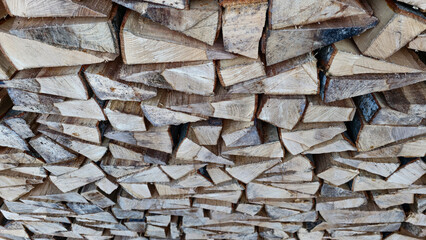 Stack of raw chopped forest wood for the oven