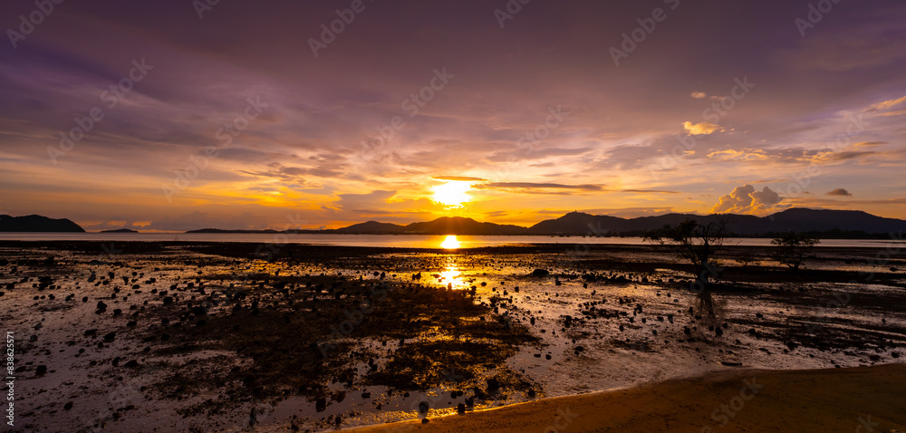 Wall mural Beautiful colorful sunset or sunrise sky over sea with dramatic clouds nature environment background