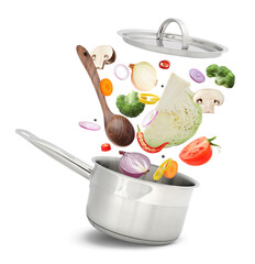 Fresh ingredients falling into saucepan on white background