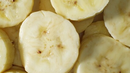 In this close-up, banana slices gleam with freshness. Their tender texture promises a delightful...