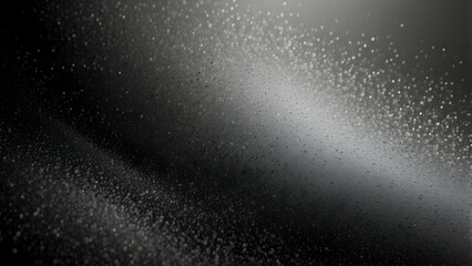 A highly detailed black and white image of water droplets creating a dynamic, textured pattern