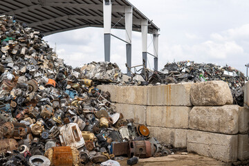 Recycling yard. Industrial scrap metal recycling. Metal car parts in junk yard