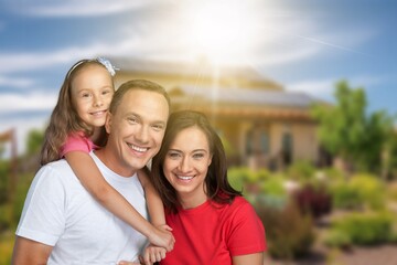 Obraz premium Happy young Family with kids together in a garden
