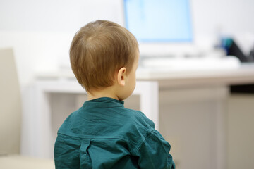 A toddler enters the pediatrician's office for a routine examination. Baby visiting family doctor. Child getting a highly qualified cure in a modern medical clinic.