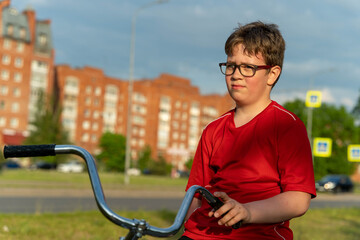 Boy on bike in city on summer day