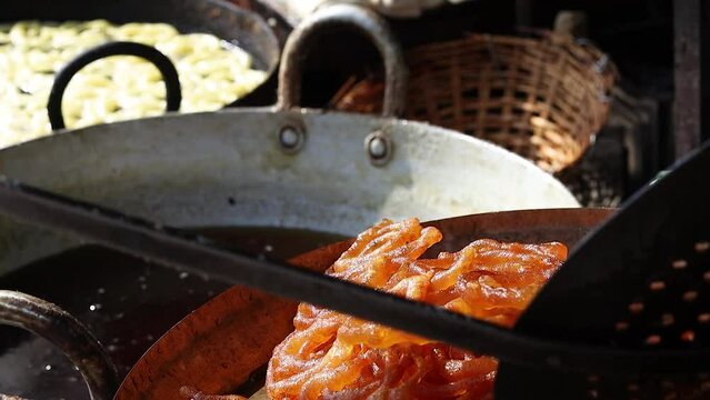 Jalebi or jilipi, freshly cooked and kept on tray for hindu festival of ratha Yatra. It is a traditional indian dessert.	