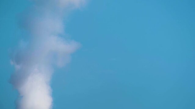 Smoke Stack On Blue Sky - Air Pollution Concept. Close Up