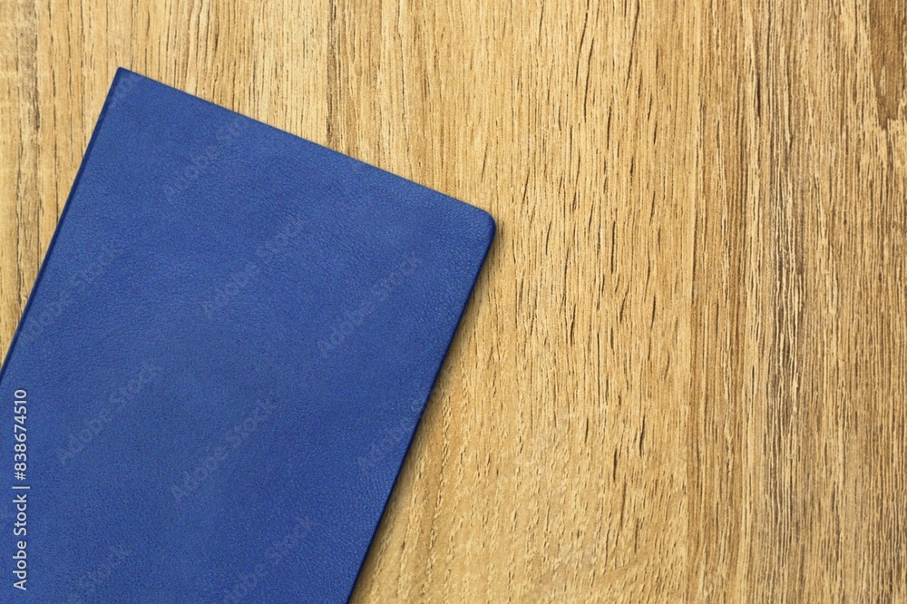 Poster Blue leather office notebook on the desk