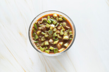 Spring Onion Coffee Or Scallion Coffee, Popular Beverage In China. Top View Glass Of Drink, Cappuccino Or Latte With Onions On Granite Table. Horizontal Plane.