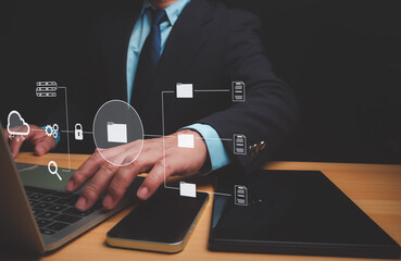 Businessman using a computer to document management, Document Management System (DMS) being setup by IT consultant working on laptop computer in office, Efficiently manage and information files.