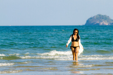 Woman body pretty with black  bikini on beach