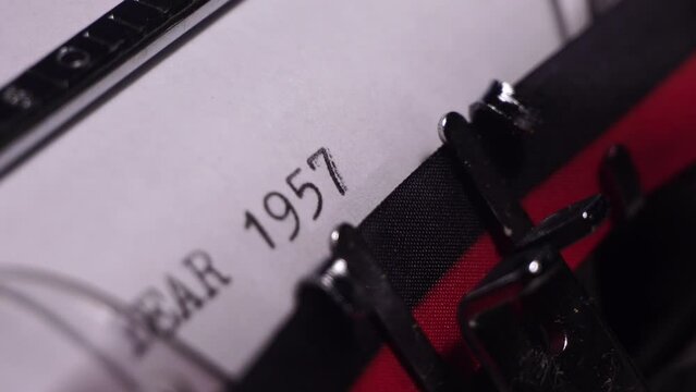 Year 1957, Typing on White Paper in Vintage Typewriter, Macro Close Up