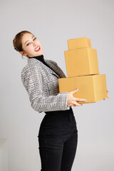 Portrait Asian smart entrepreneur business woman in casual suit surround by parcel boxes service...