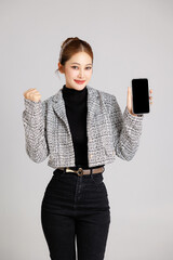 Asian smart happy entrepreneur business woman smile in casual suit gesture showing blank screen...