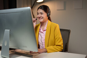 Asian business woman, call center working in office Attractive office worker sitting at desk,...