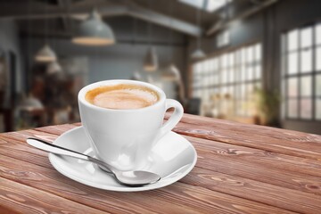 Wooden table at coffee shop  with a cup