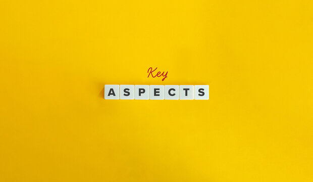 Key Aspects Phrase and Banner. Crucial or Essential Element, Feature, or Component. Text on Block Letter Tiles on Yellow Background.