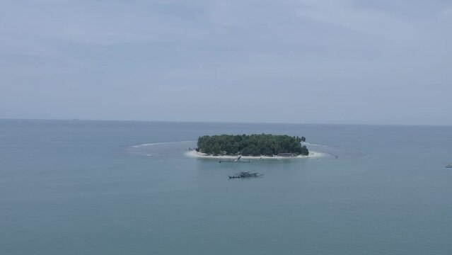 Establish aerial view of the Angso Duo Island tourism in Pariaman City, West Sumatra. d-log raw stock video