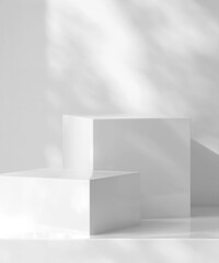 Two modern white geometric cuboid podium in dappled sunlight, leaf foliage shadow for organic...