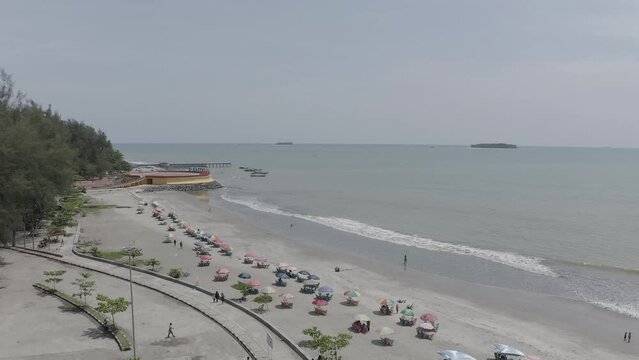 Establish aerial view of the Gandoriah beach tourism in Pariaman city, West Sumatra. d-log raw stock video