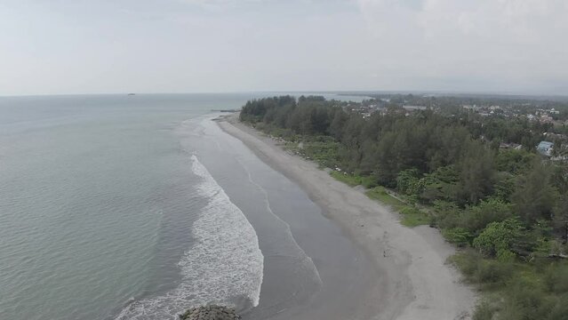 Establish aerial view of the Beach in Pariaman City, West Sumatra. d-log raw stock video