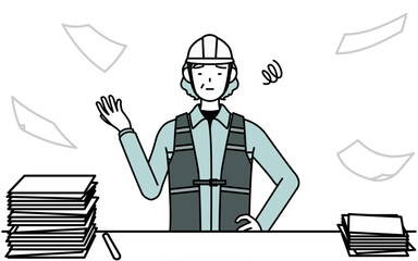 片付かない業務にうんざりするヘルメットと作業着姿のシニア女性技師