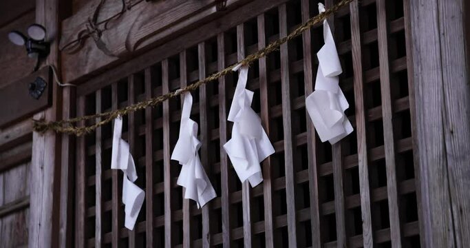 Paper streamers on Japanese old shrine at the countryside in Gunma Japan