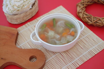 A bowl of vegetable soup on a table