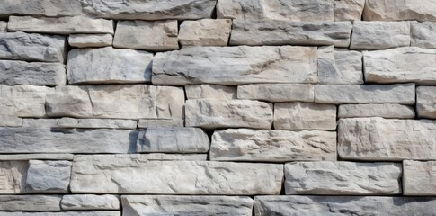 stone textured wall of a building featuring a large gray rock as the centerpiece
