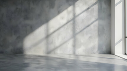Fototapeta premium Empty concrete room with sunlight streaming through large windows, creating geometric patterns. Minimalist design with gray textured walls.