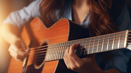 Fototapeta premium Close-up, female musician playing guitar.