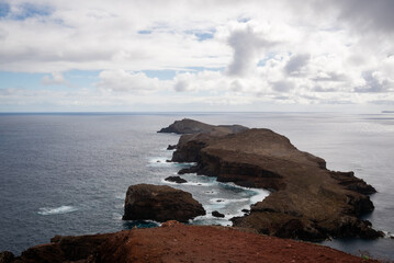 an image of some water rocks and some water and some clouds