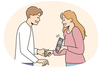 Pregnant woman holding ultrasound picture with baby showing future kiddy to happy father. Positive couple of man and girl getting ready to become parents and holding hands after going to doctor