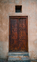 Antique wooden door mounted on a wall