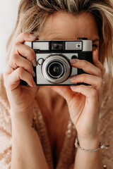Close-Up of Woman Holding Vintage Camera