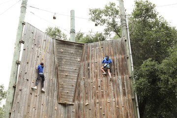 Girls rock climbing at summer camp in Ojai, California.