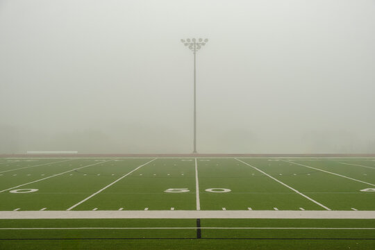 50 Yard Line View of American Football Field with Fog