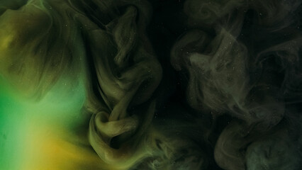 Night mist. Paint water mix. Defocused green color glitter particles texture smoke cloud floating...