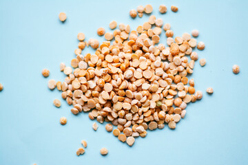 Pile of peas. Top view on blue isolated background with text space. World Food Safety Day. High quality photo