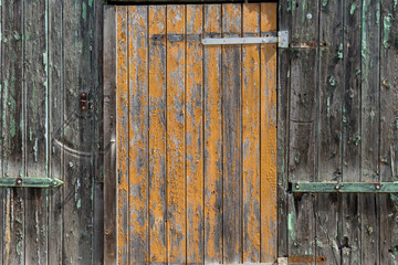 Background with weathered wooden wall and wooden door