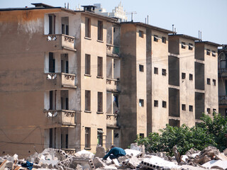 Old Khrushchyovka walk-up residential apartment buildings at a demolition site in Liuzhou, Guangxi...