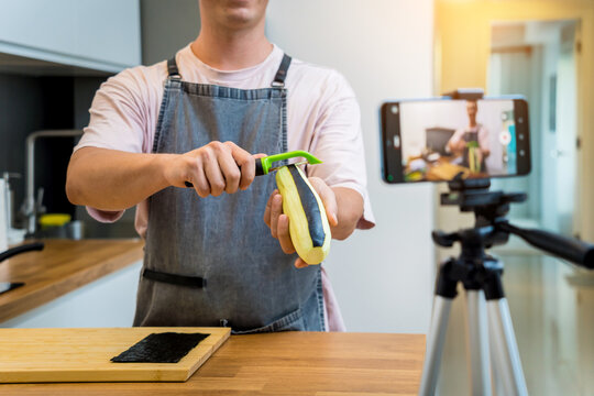 The chef is broadcasting live from workshop how to prepare a grilled eggplants with garlic