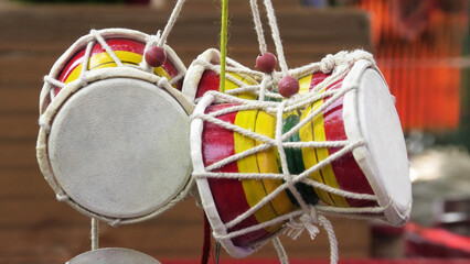 Colorful toy drums displayed in a handicraft shop