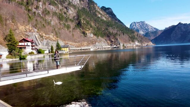 African Tourist in Upper Austria, near Traunsee lake in Ebensee, Salzkammergut region, serene mountain backdrop