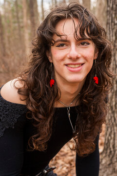 androgynous teen posing in the woods
