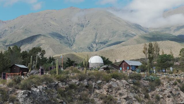 Aerial view above astromical observatory in Amaicha del Valle, Argentina with majestic mountain landscape.
