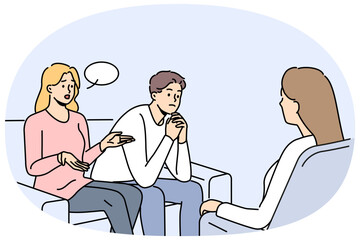 Couple at family therapist in office, sitting on couch talking about problems and quarrels. Woman family therapist helps people get rid of conflicts and misunderstandings in their life together