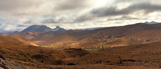 panorama landscape view of the Altas mountains in Morocco with small villages dotting the hillsides