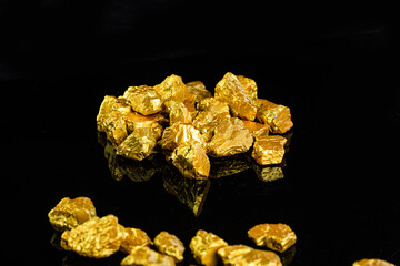 Closeup of big gold nugget finance concept